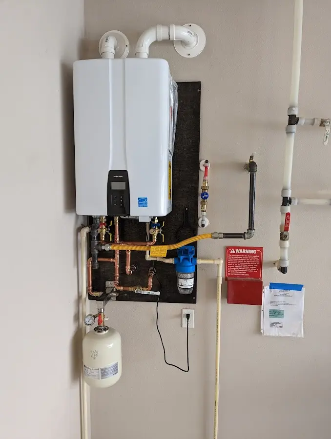 Professional plumber installing copper piping in a Port St. John home